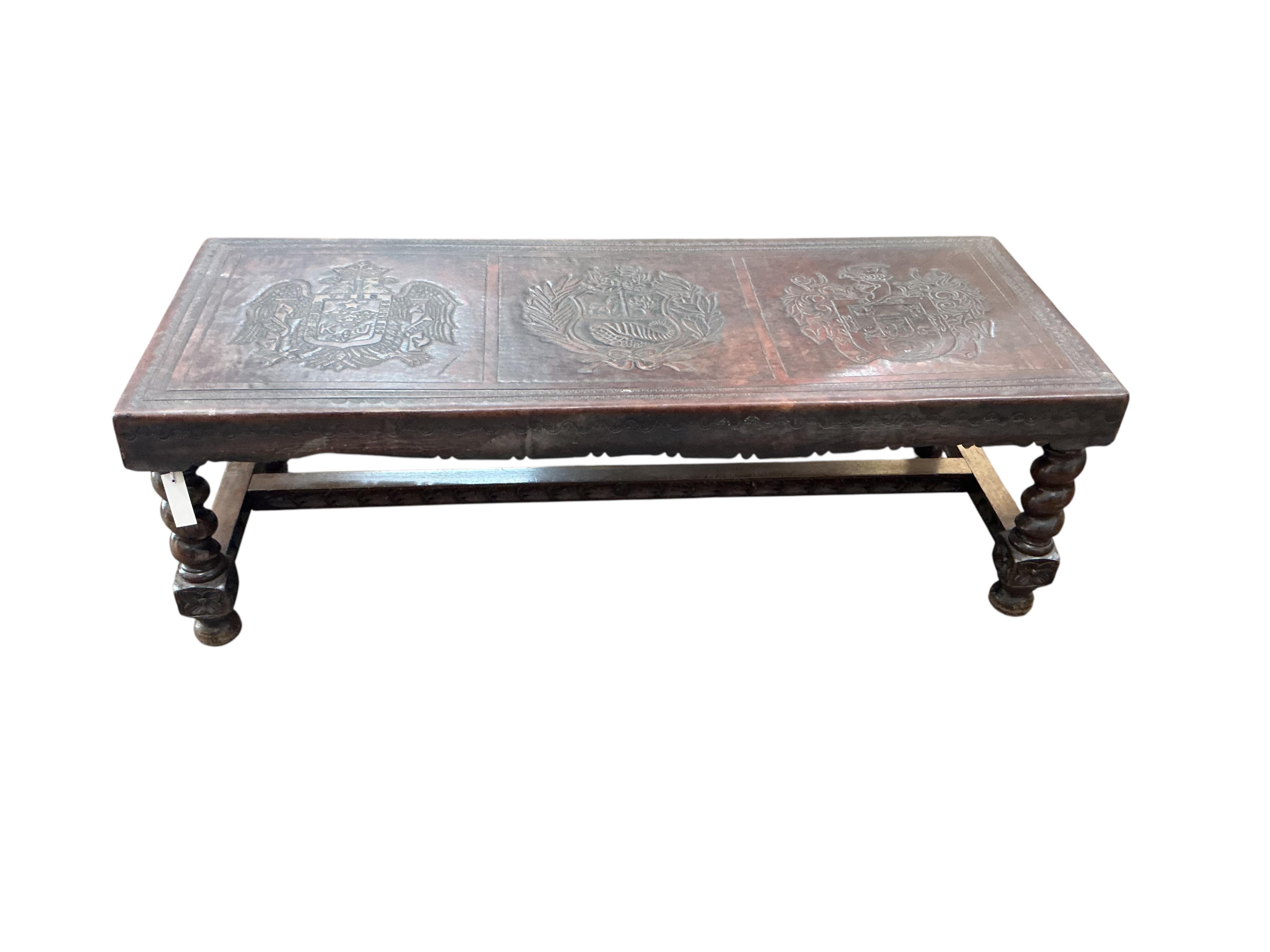 A Peruvian rectangular embossed leather turned wood coffee table, width 128cm, depth 50cm, height 42cm together with a similar nest of tables